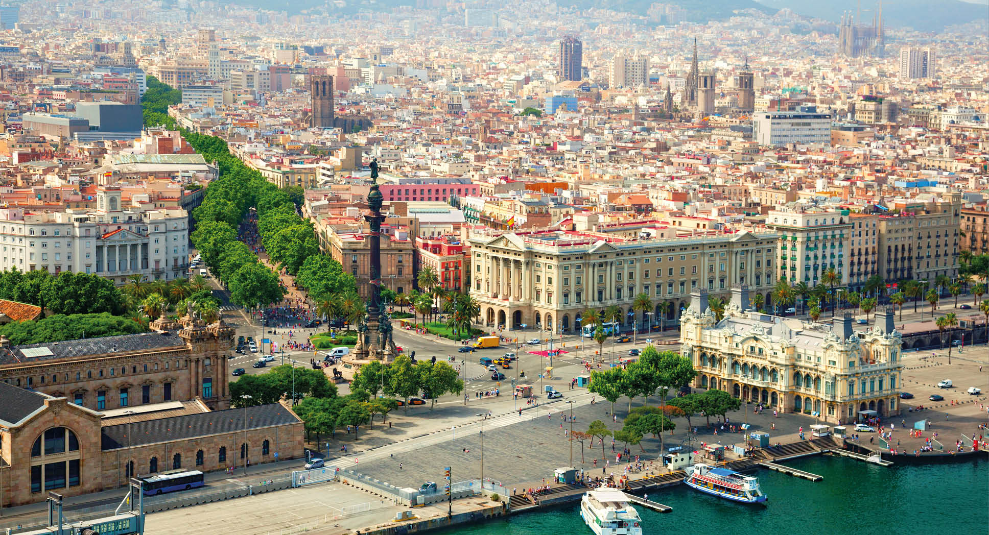 Barcelona city view. Columbus monument and La Rambla on the left