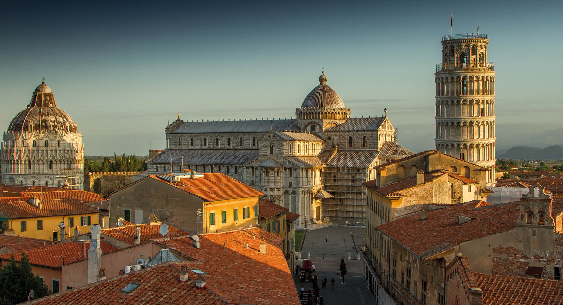 A view of Pisa's Cathedral Square, featuring the Cathedral, the Tower and the Baptistery, taken just after sunrise.