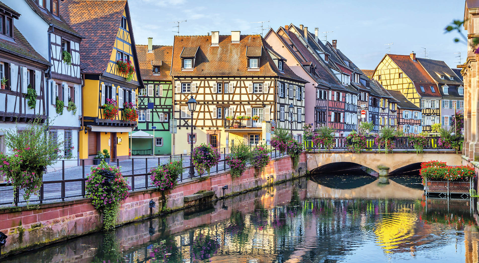 Colorful traditional french houses on the side of river Lauch in Petite Venise, Colmar, France