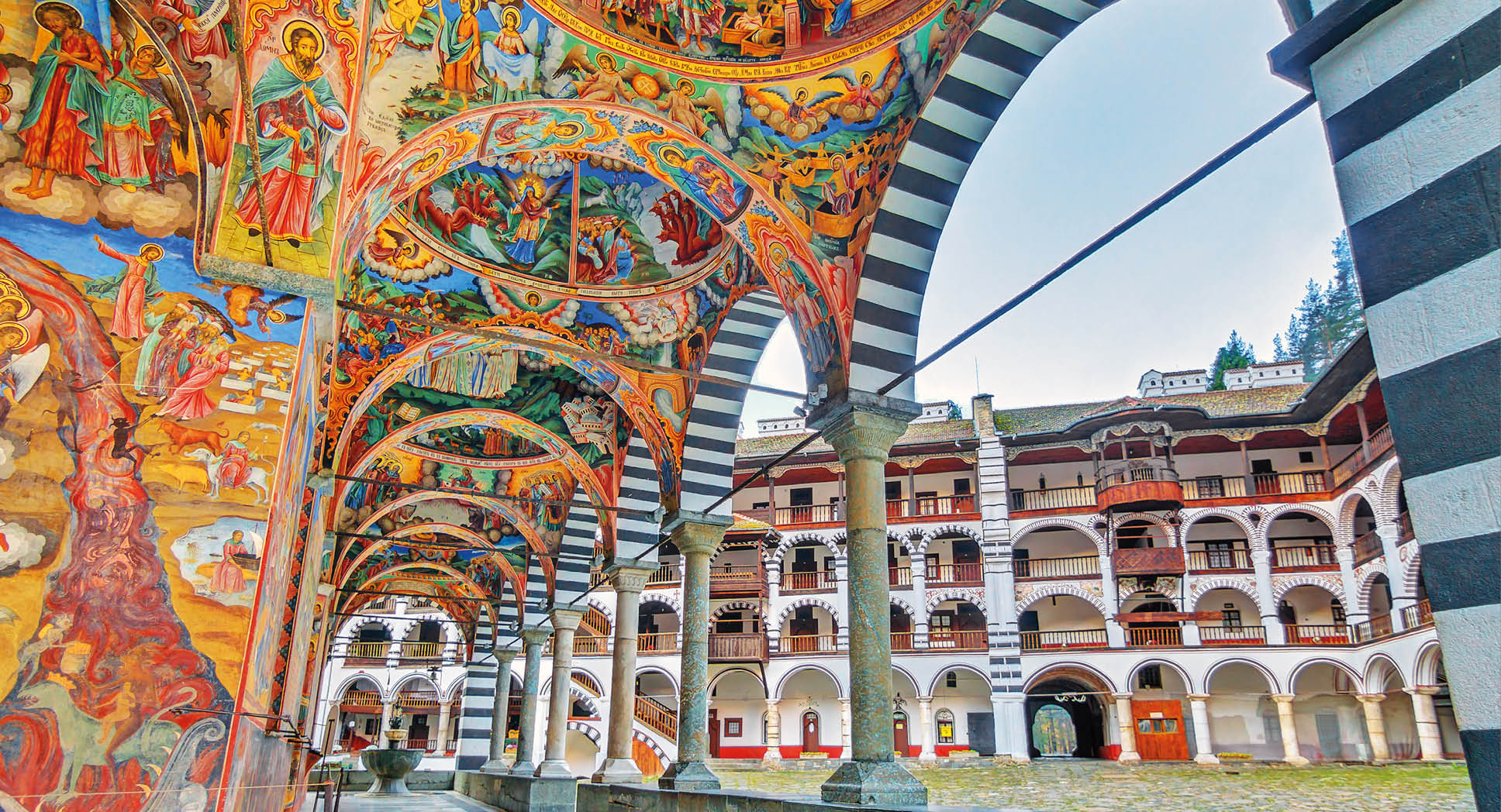 Beautiful view of the vibrant decoration of the Orthodox Rila Monastery, a famous tourist attraction and cultural heritage monument in the Rila Nature Park mountains in Bulgaria