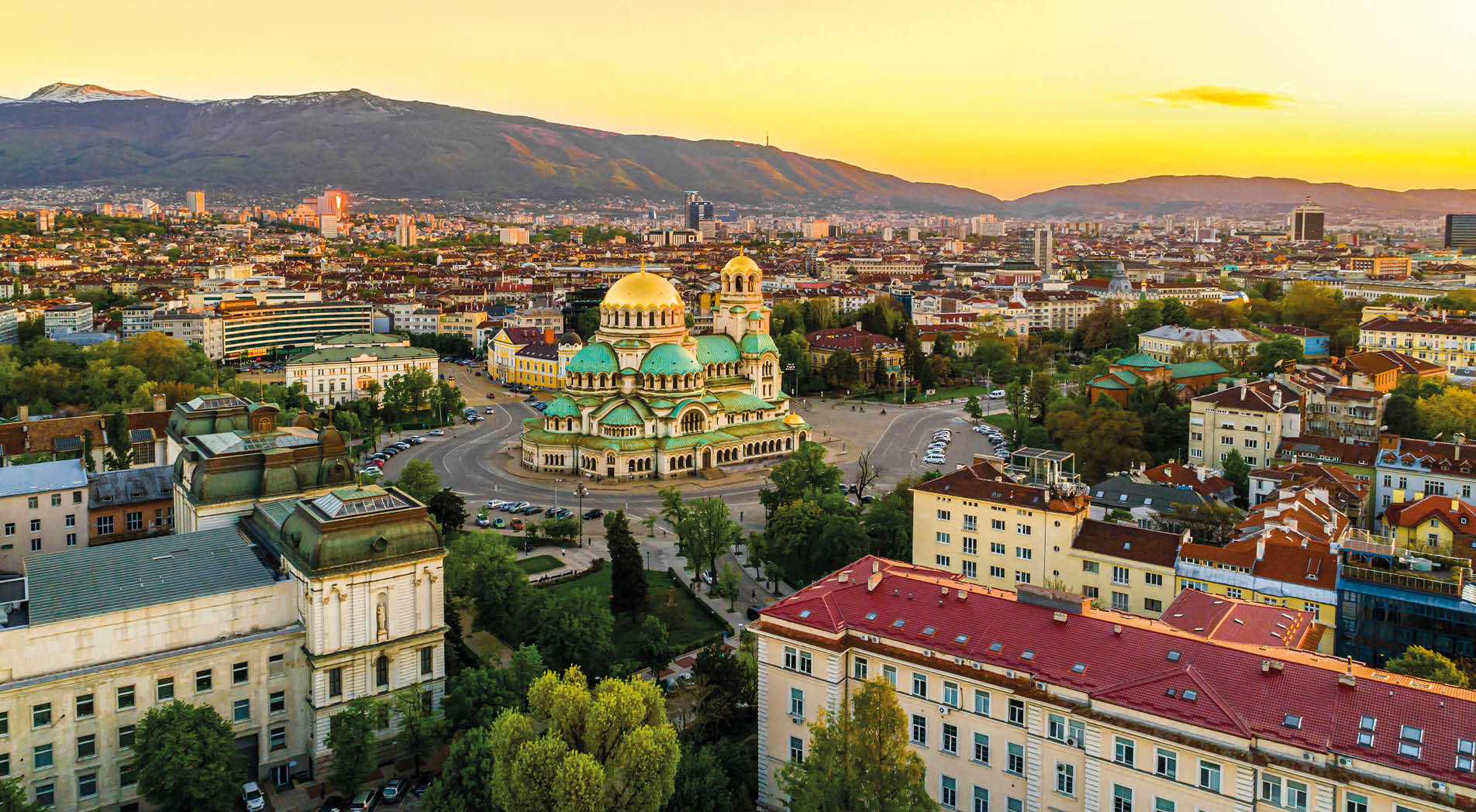 Beautiful drone shot of downtown district of Sofia, Bulgaria, St. Alexader Nevski Cathedral in the middle, gold colored domes. (Bulgarian: Красив кадър от дрон на централната част на София, България, храм-паметник Свети Александър Невски в средата, златни куполи/кубета). The photo is taken with drone DJI Phantom 4 Pro.