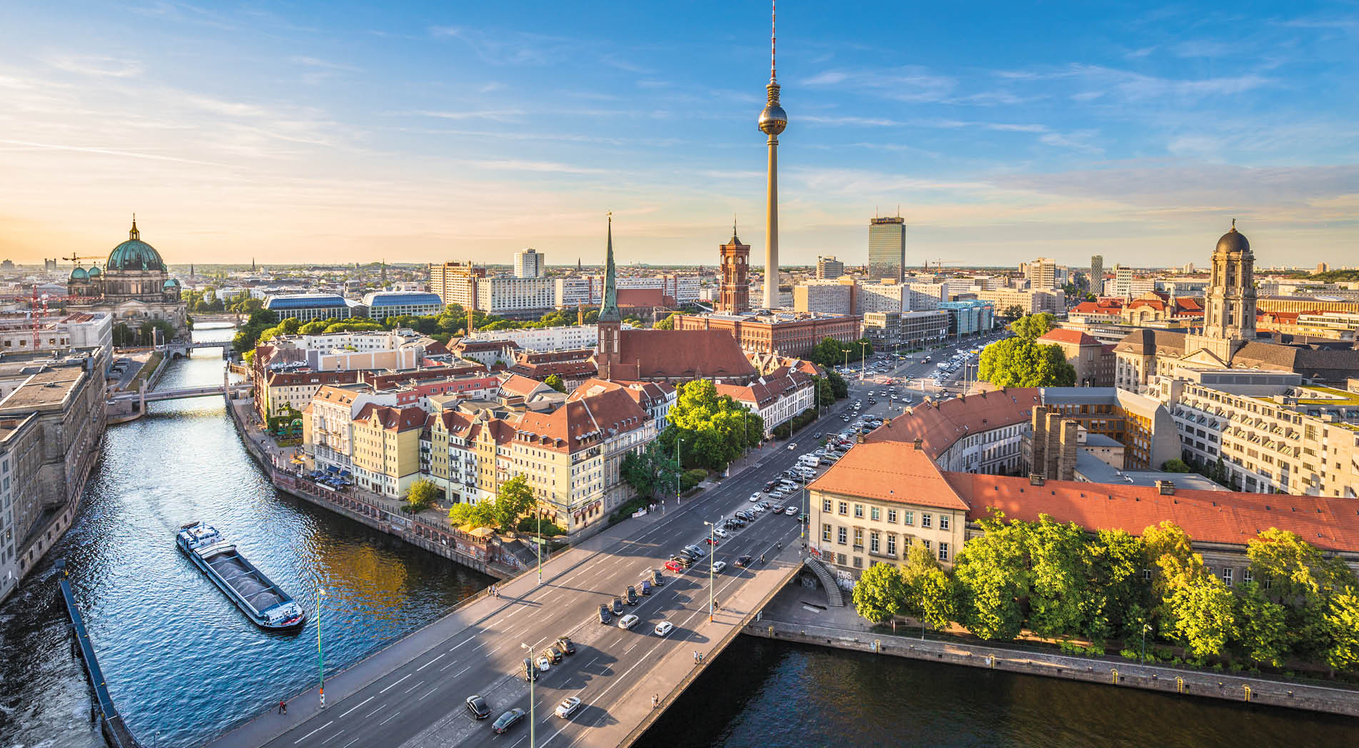 Aerial view of Berlin skyline with famous TV tower and Spree river in beautiful evening light at sunset, Germany