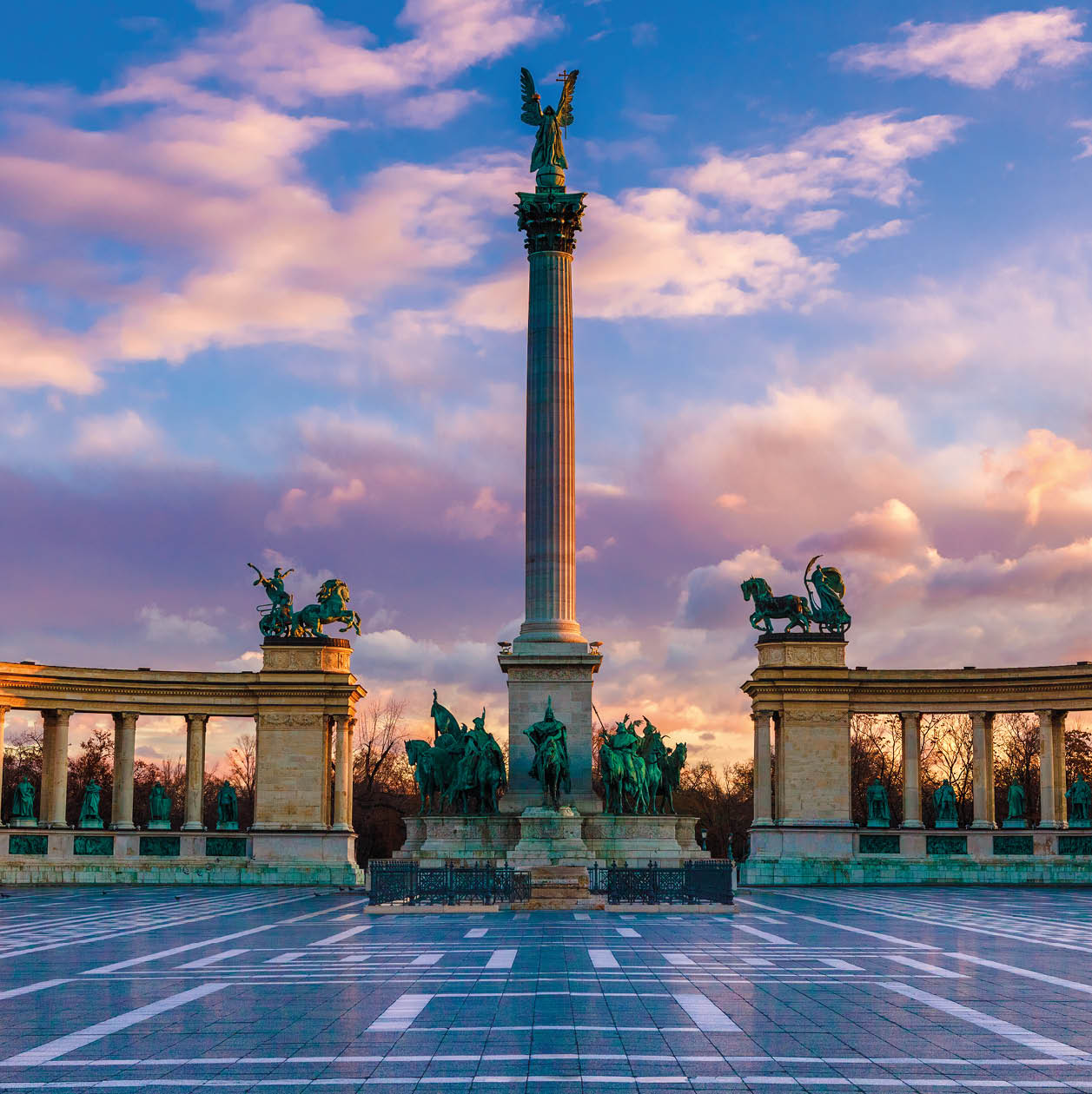 Heroes Square Budapest in morning. The square is the end of Andrassy Avenue, this street is part of Unesco World Heritage. This photo was made after a rain, the reflection is real, not composit image.