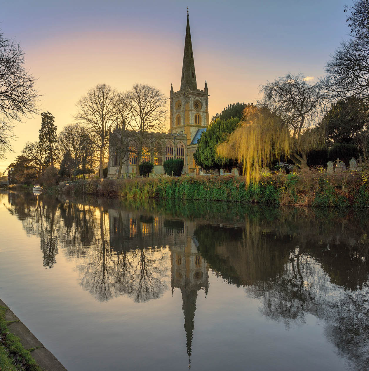 shakespeares burial place holy trinity church stratford-upon-avon warwickshire the midlands england uk. reflections in the river avon.