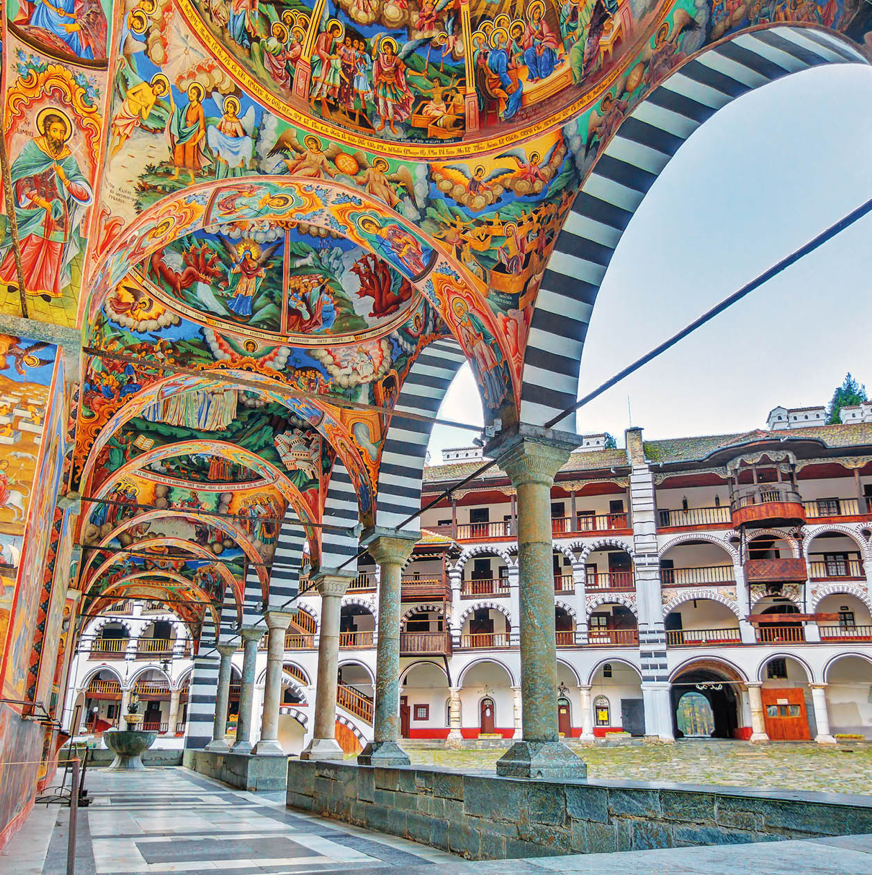 Beautiful view of the vibrant decoration of the Orthodox Rila Monastery, a famous tourist attraction and cultural heritage monument in the Rila Nature Park mountains in Bulgaria