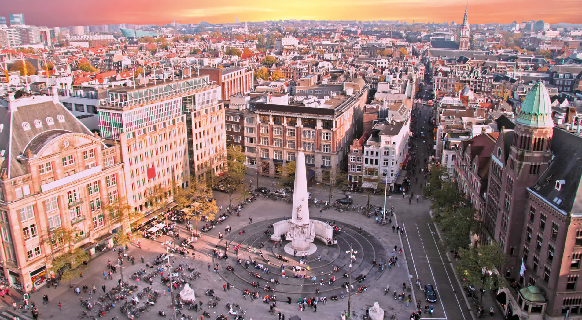 City scenic from Amsterdam with the Dam in the Netherlands at sunset