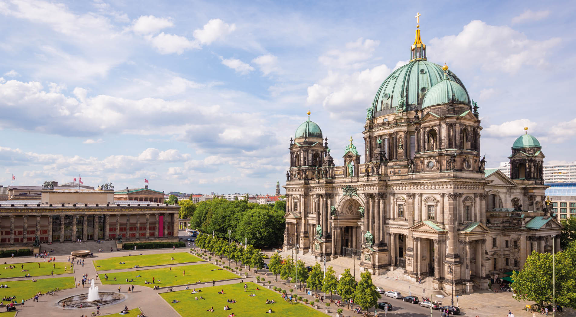Aerial view down to with tourists and visitors crowded Lustgarten Park next to the famous Berliner Dom in Downtown Berlin, Germany.