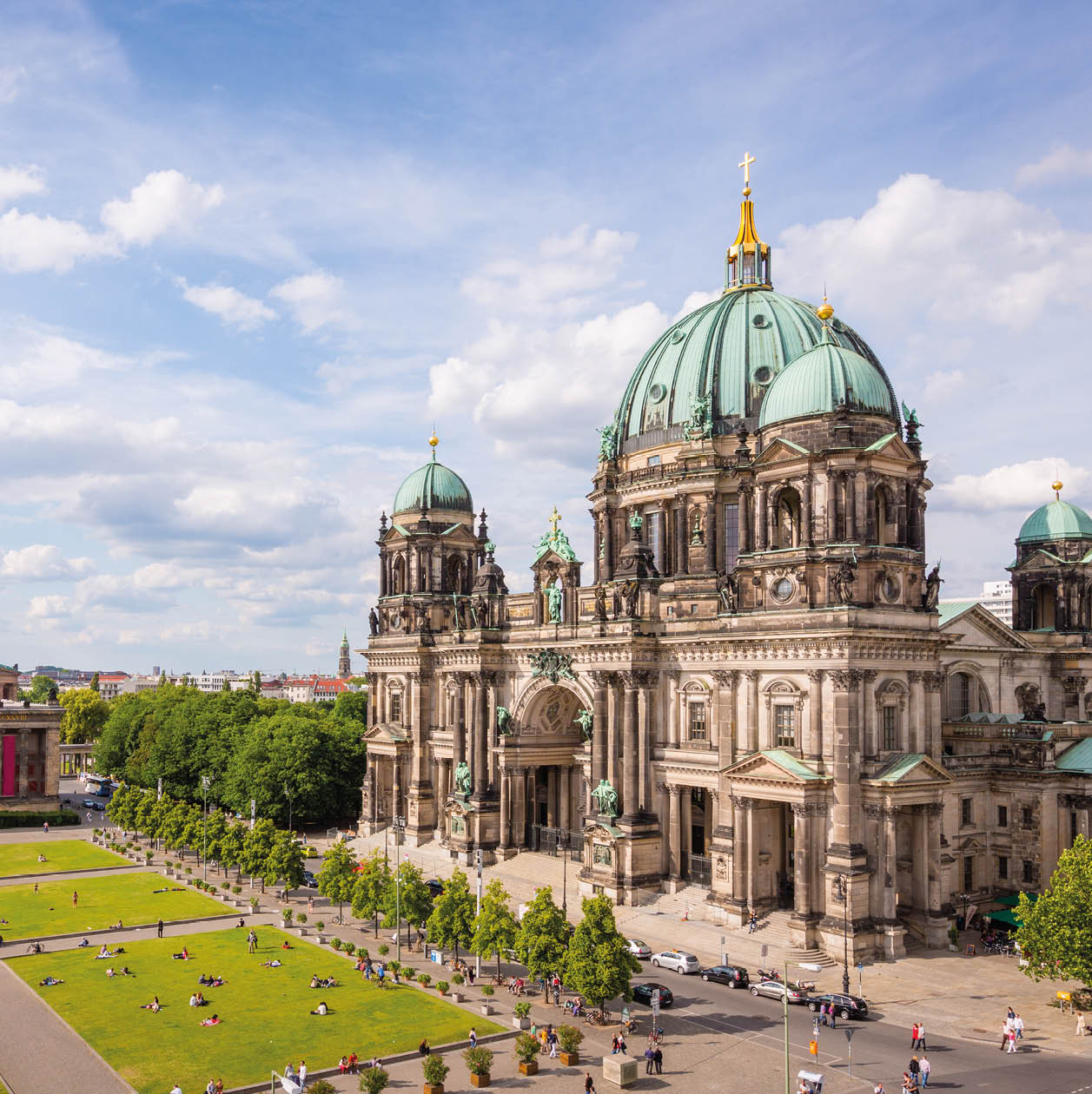 Aerial view down to with tourists and visitors crowded Lustgarten Park next to the famous Berliner Dom in Downtown Berlin, Germany.