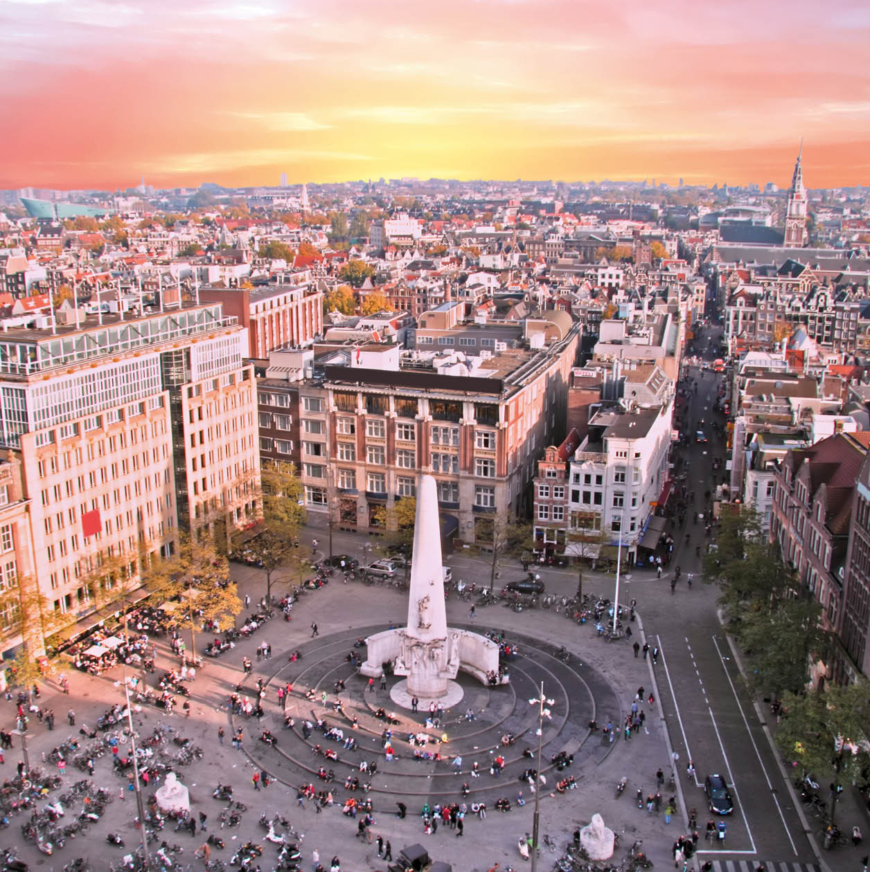 City scenic from Amsterdam with the Dam in the Netherlands at sunset