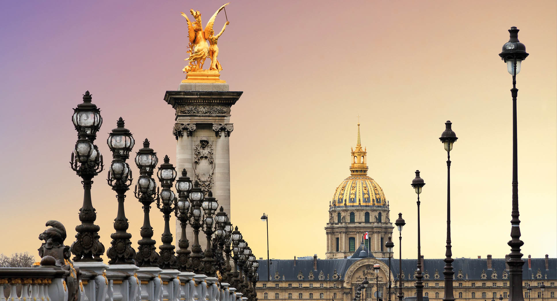 Beautiful sunrise at the Pont Alexandre III and Les Invalides in Paris
