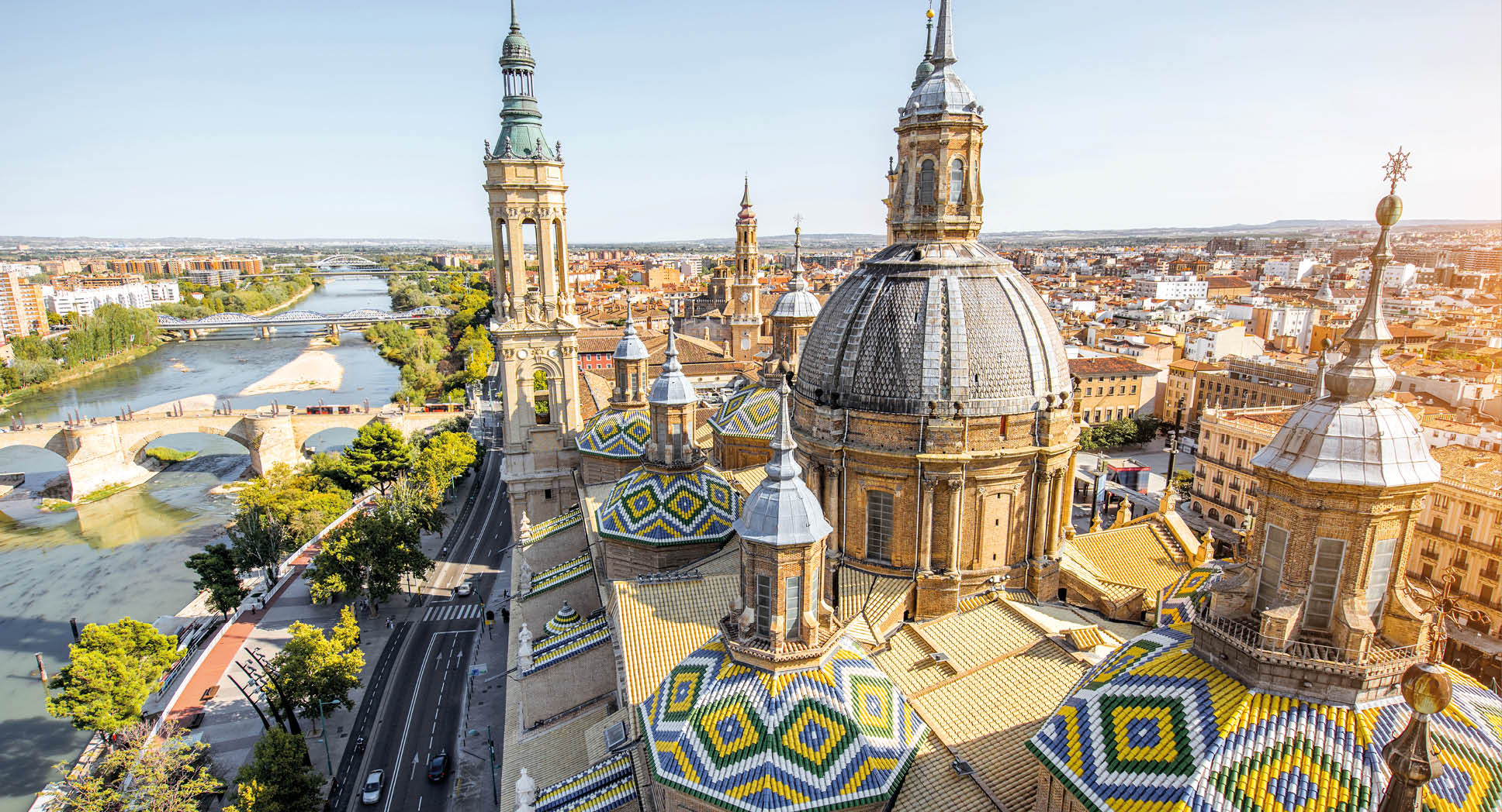 Aerial cityscape view on the roofs and spires of basilica of Our Lady in Zaragoza city in Spain