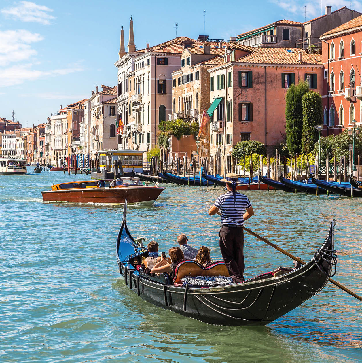 Gondola on Canal Grande in Venice, in a beautiful summer day in Italy