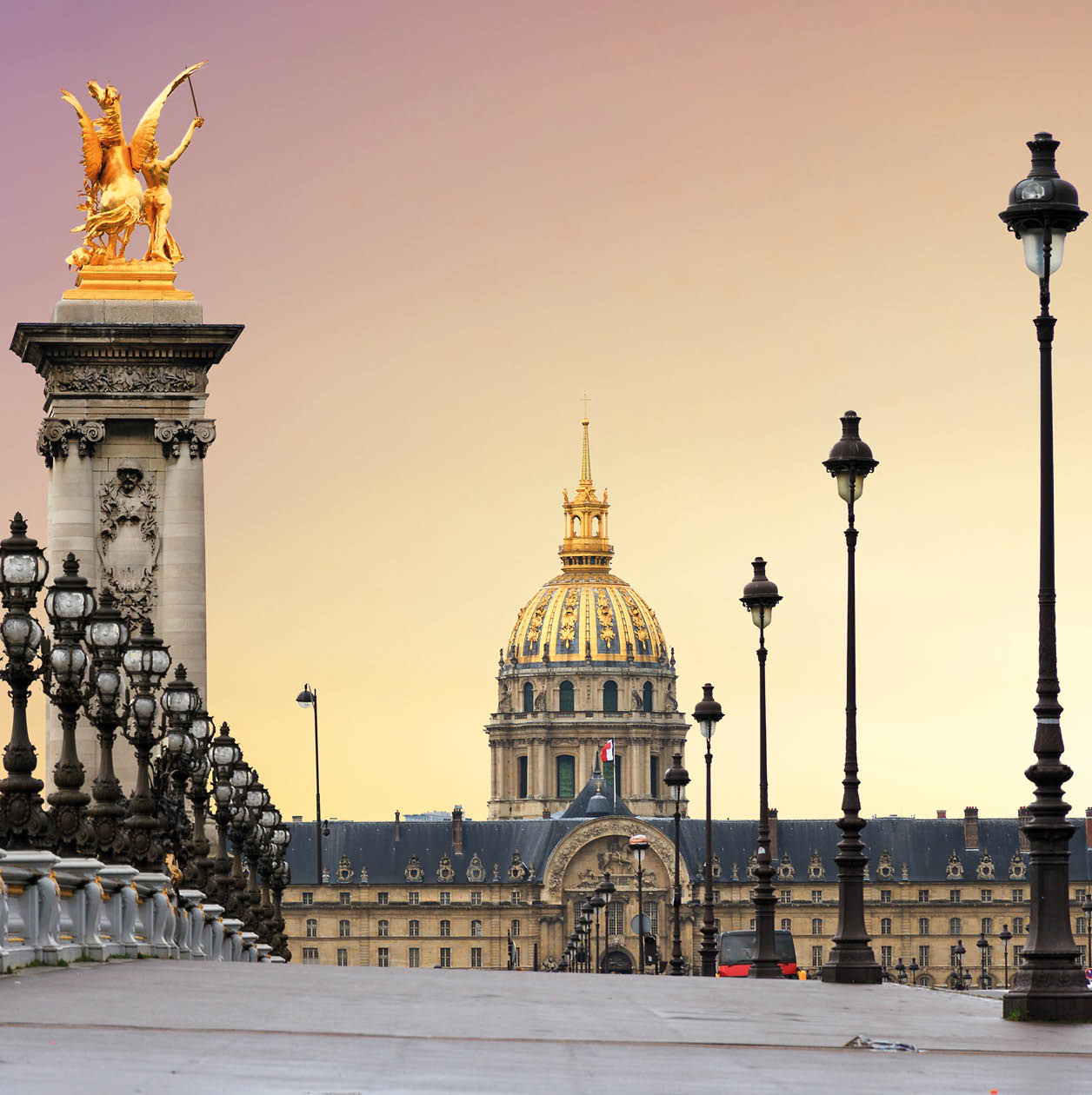 Beautiful sunrise at the Pont Alexandre III and Les Invalides in Paris