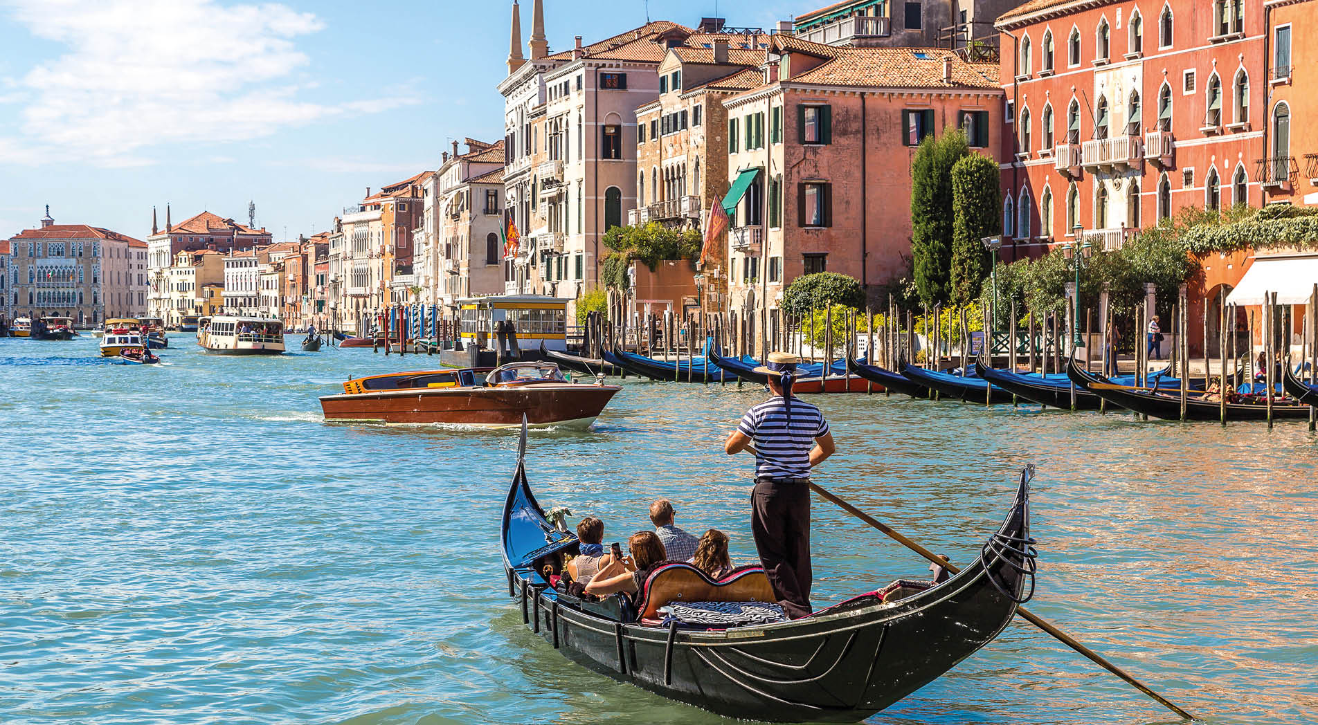 Gondola on Canal Grande in Venice, in a beautiful summer day in Italy