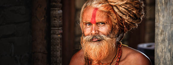 Holy man - Sadhu with very long dreads in temple. 