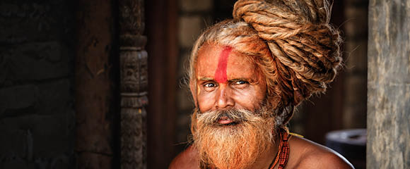Holy man - Sadhu with very long dreads in temple. 